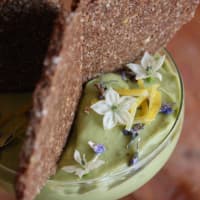 Sweet cream of avocado with rosemary and lemon with biscuit