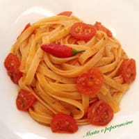 Pasta with spicy sauce with cherry tomatoes