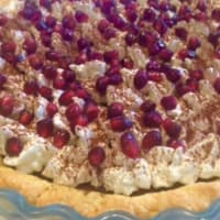 Crostata con ganache di cioccolato fondente e panna con melagrana