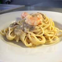 Trenette with prawns, artichokes and lemon zest