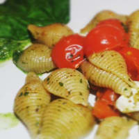 whole shells with arugula pesto, salt first and cherry tomatoes