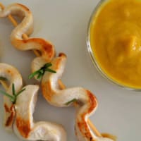 Chicken skewers served with pumpkin sauce