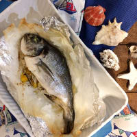 Sea bream baked in foil with citrus and pomegranate