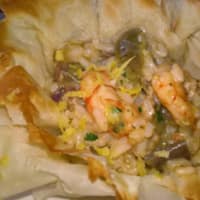 Risotto with shrimp and artichokes in filo pastry baskets
