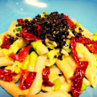 Pasta with bean cream, dry tomato and black olives powder