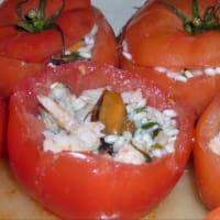 Tomatoes stuffed with rice and seafood