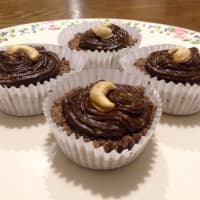 Cocoa cupcakes stuffed with peanut butter with avocado topping