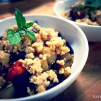 Crumble of eggplant and cherry tomatoes with pine nuts