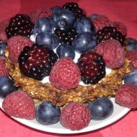 Basket of rice flakes and banana with yogurt and berries