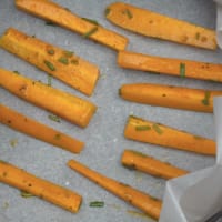 Sticks of baked carrots in the oven step 3