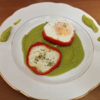 Pepper with egg heart on bed of pea cream