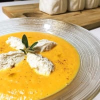 Cream of carrots with quinelle cinnamon ricotta