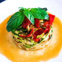 Spaghetti with zucchini sautéed with cherry tomatoes and ginger