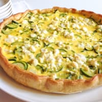 Savory pie with courgettes, feta cheese and salami