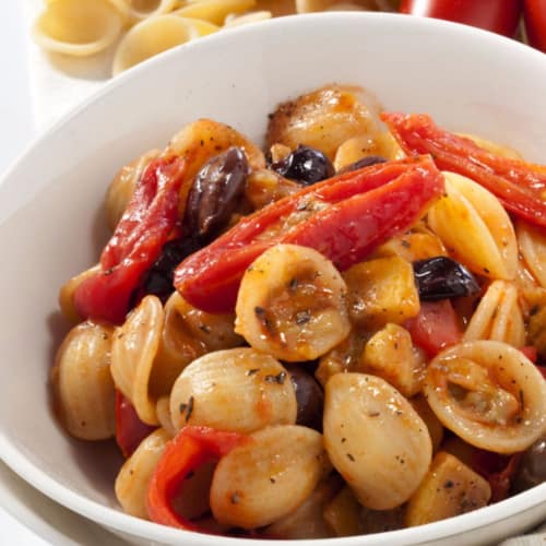 Apulian appetizers with cherry tomatoes, olives and aubergines