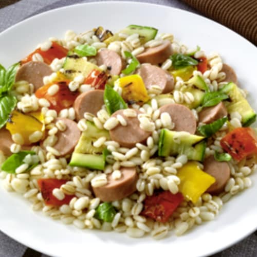 Rice salad with vegetables and sausage