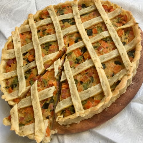 Quiche with celery, carrots, potatoes and bacon