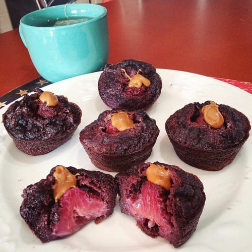 Cocoa muffins and strawberries with peanut butter