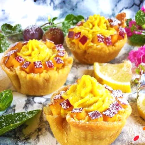 Vegan baskets stuffed with peach cubes and vegan cream