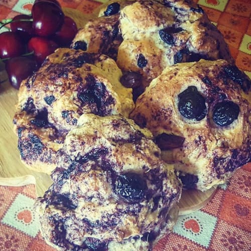 Sweet muffins with blueberries and cherries