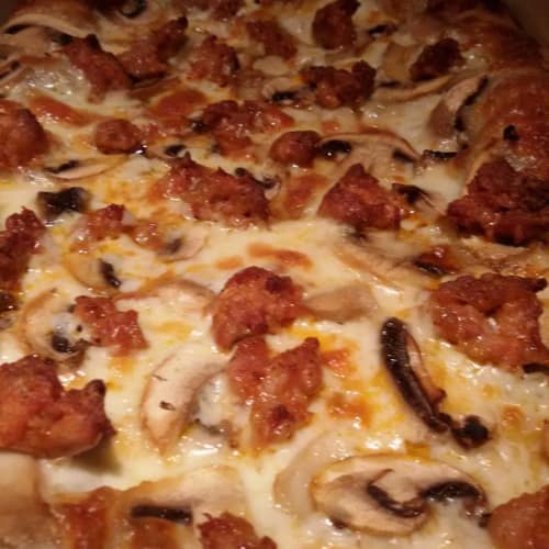 Sausage pizza pizza and mushrooms