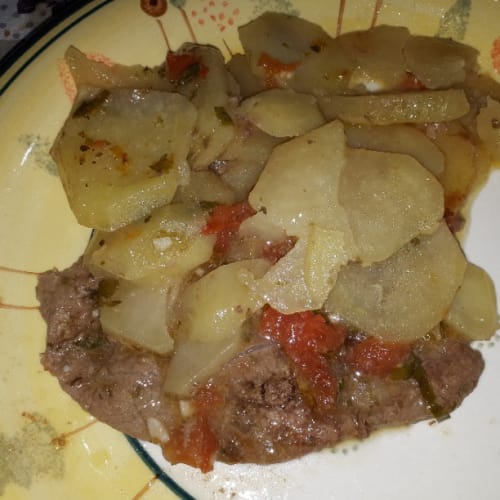 Pizzaiola meat with potatoes