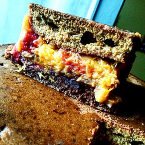 Two-colored poured cake with orange and strawberry jam