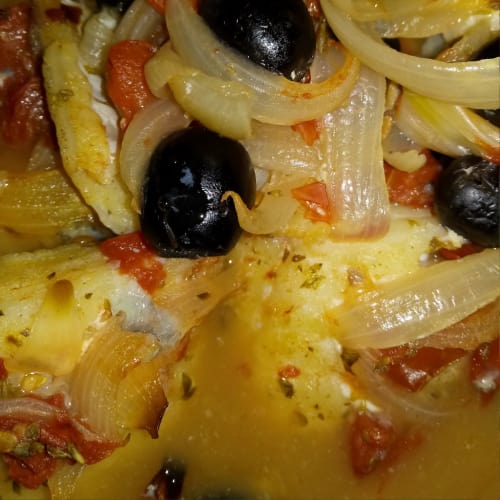 Stewed cod with black olives