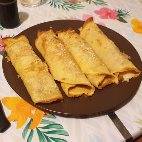 Rolls of speck crepes and fontal