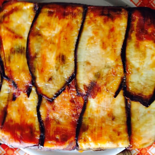 Baked pasta covered with eggplant