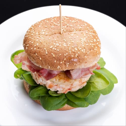 prawn hamburger with crunchy bacon and baby spinach