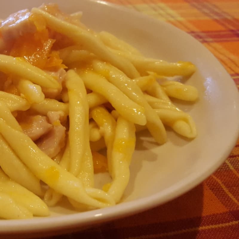 Homemade pasta with pumpkin and swordfish