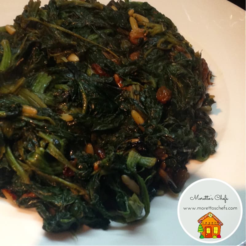 spicy spinach sauteed with raisins and pine nuts