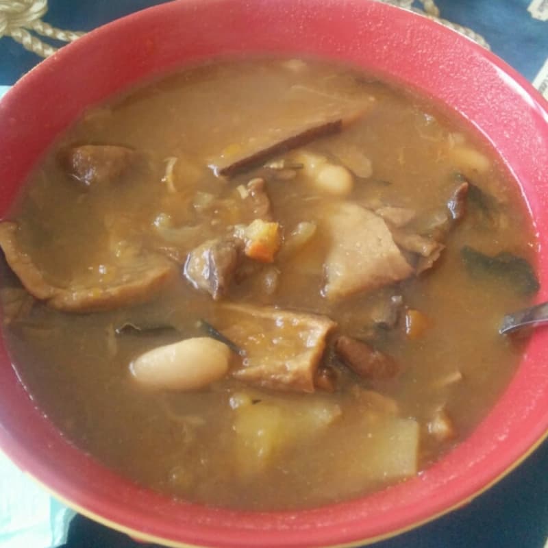 Soup with pumpkin, mushrooms, potatoes and beans