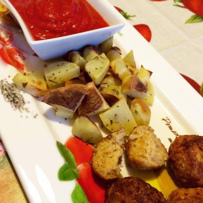 turkey meatballs with baked potatoes and pepper sauce