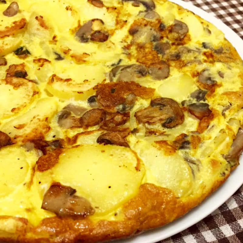 Omelette with mushrooms, potatoes and ham