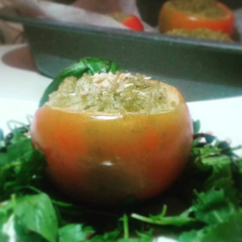 Baked tomatoes stuffed with basmati rice and homemade pesto