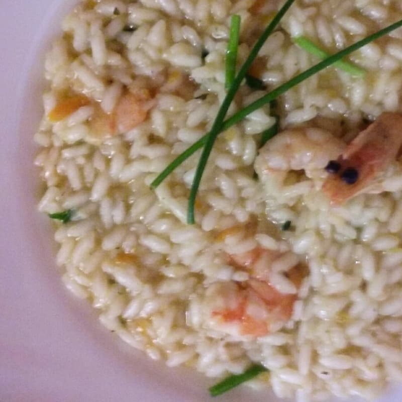 Risotto con mazzancolle aromatizzato con erba cipollina