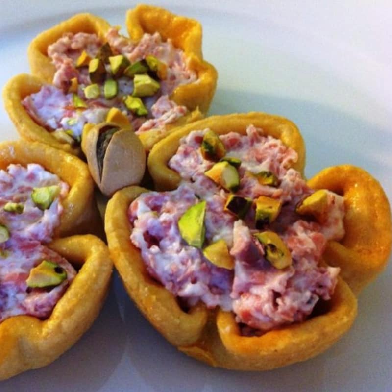 Brisée pasta baskets with ricotta, mortadella and pistachios