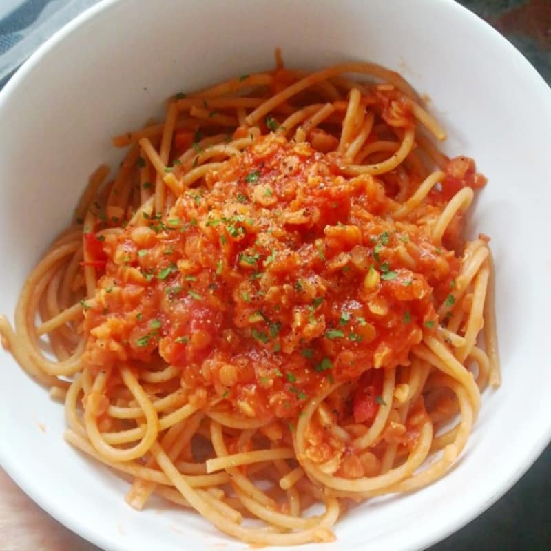 whole wheat spaghetti with red lentil sauce and cherry tomatoes