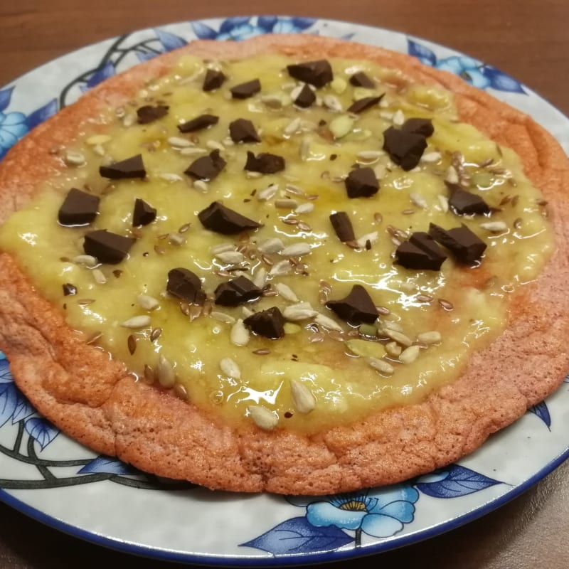 Pink pancake topped with banana cream