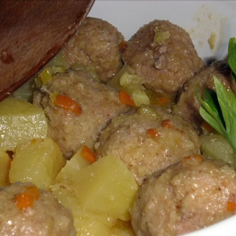 Stewed meatballs with potatoes and carrots