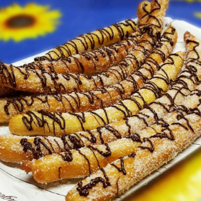 Foto Ricetta Churros with chocolate and cinnamon Foto Ricetta Churros with chocolate and cinnamon