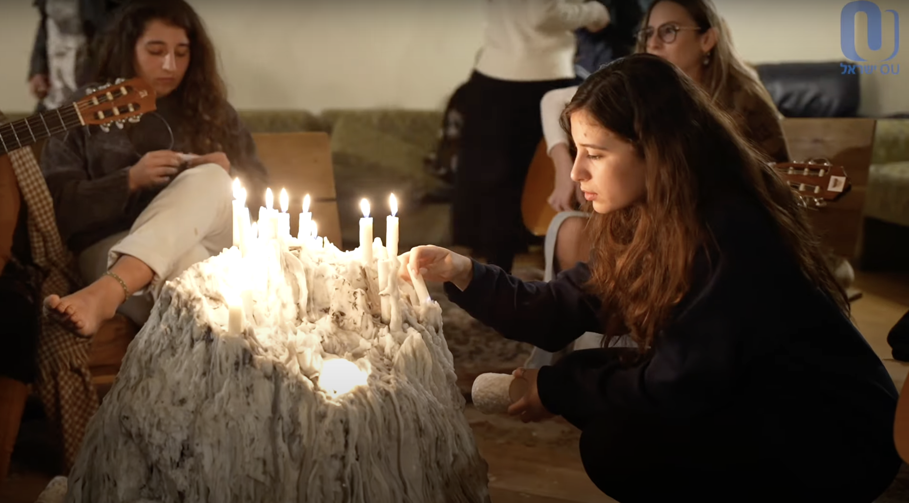 Girls lighting candles at the Zula (placeholder)