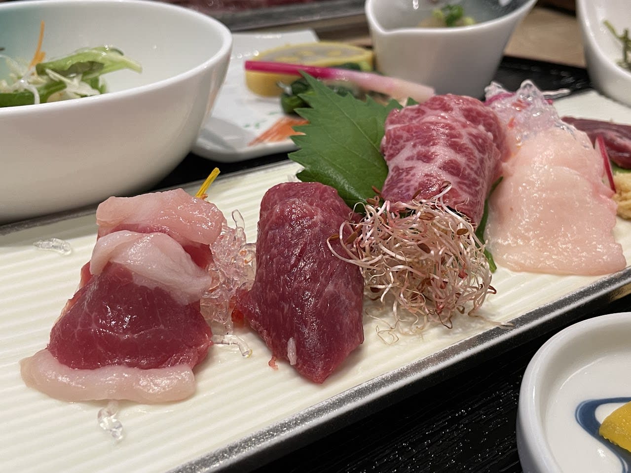 Eating horse sashimi.