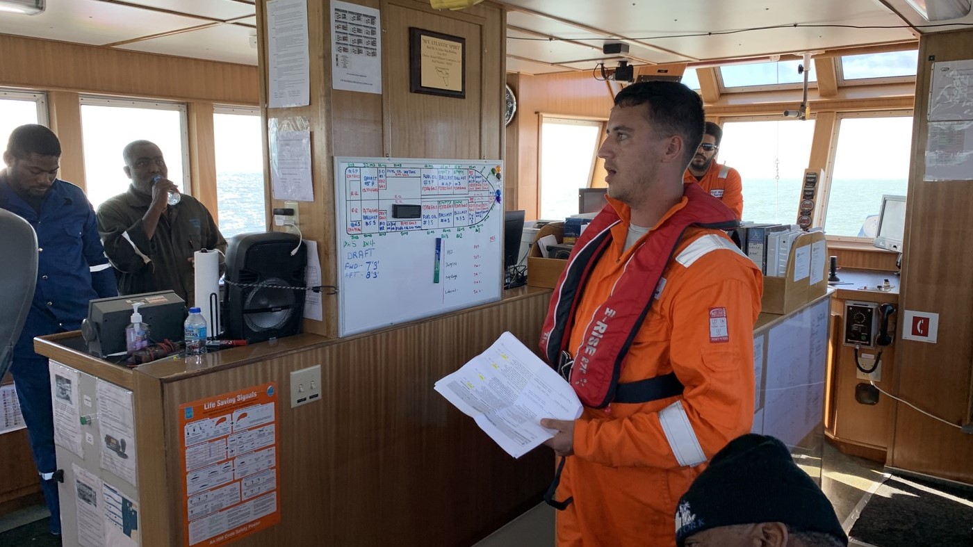 A group of OSRL responders in a vessel’s command centre reviewing contingency plans and operational procedures during an emergency response exercise in Suriname.