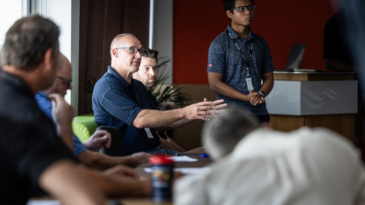 A multi-disciplinary group engaged in a planning session, reflecting collaborative thinking and joint decision-making critical to building a strong contingency plan.