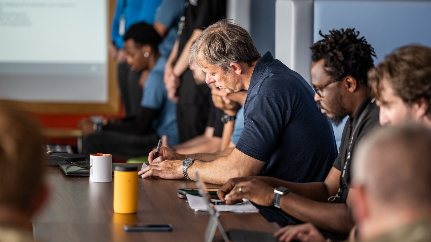 This photograph highlights teamwork during the ENDEX exercise, showcasing professionals collaborating, sharing ideas, and recording insights. Such planning sessions are vital for preparing effective responses to real-world scenarios like environmental or industrial incidents.