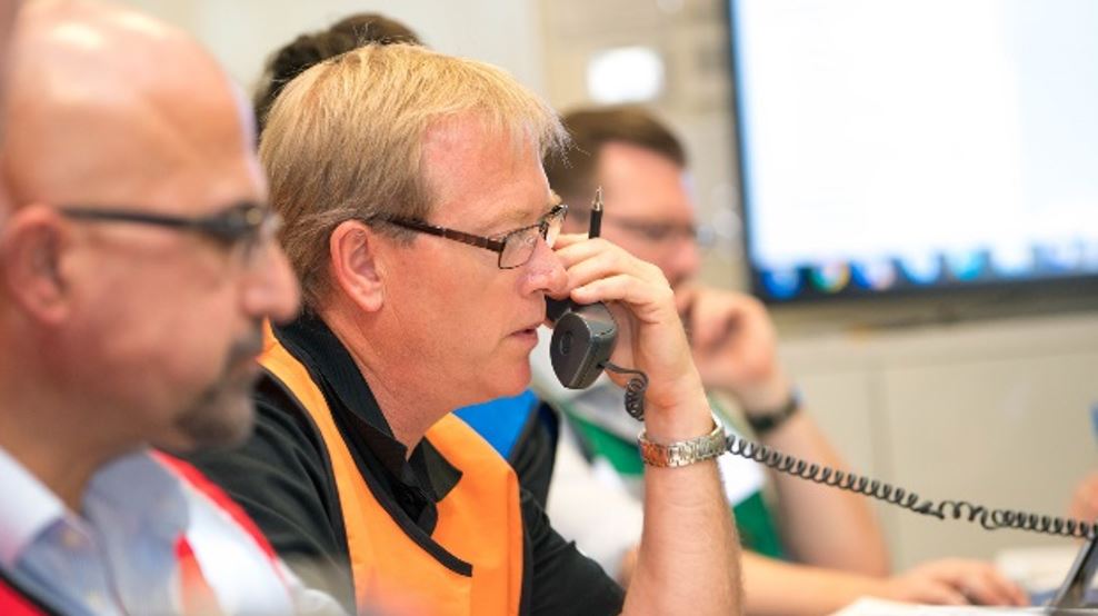 Inside the emergency operations centre, response leaders communicate with field teams, ensuring seamless coordination and decision-making during the large-scale maritime environmental emergency exercise.