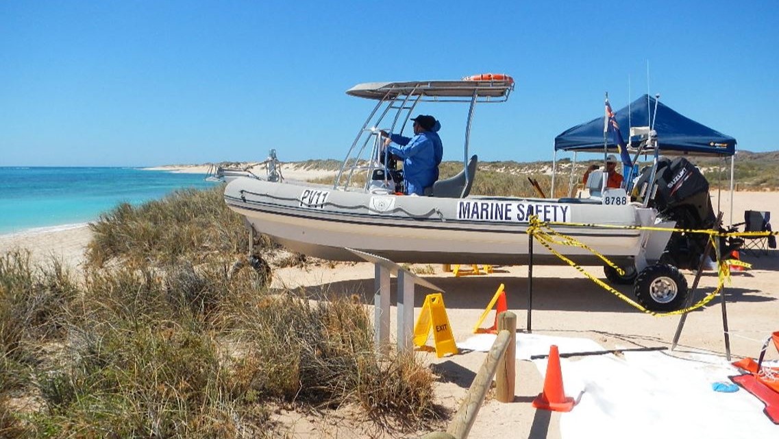 A marine safety patrol boat stationed on the shore, ready for immediate deployment in coastal emergency response operations as part of the Western Australia MEER exercise.